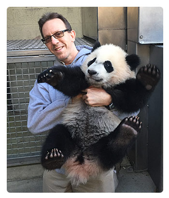 Dr. Don Neiffer with panda cub